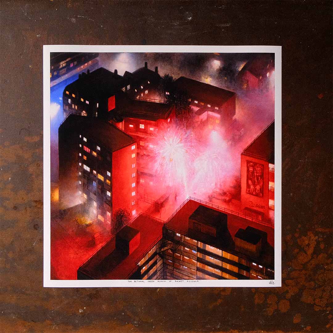 A print of the painting 'The Bethnal Green School of Rocket Science' by Lawrence Brand 2026 laying flat on a table